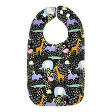 Load image into Gallery viewer, Baby bib Everyday Bib by Mimi's Little Loveys. Fun and vibrant design, featuring crocodiles, elephants, flamingos, giraffes, hippos, tortoises, plants, and flowers, on a black background. Backing is soft, white, terry cloth.