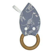 Load image into Gallery viewer, Baby Crinkle Teether by Mimi's Little Loveys. Fun, white, dinosaur skeletons on a gray background, and a wooden teething ring.