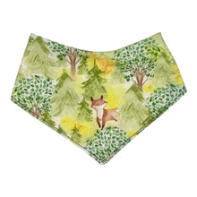 Load image into Gallery viewer, Baby bandana bib by Mimi's Little Loveys. Features cute foxes, raccoons, squirrels in a forest scene. Shades of browns, oranges, grays, and greens, on a yellow background.