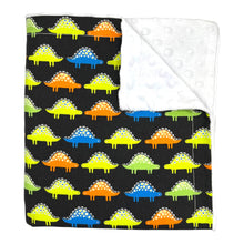 Load image into Gallery viewer, Baby & Kids' Blanket with colorful dinosaurs on a black background. The corner is folded over to show a white backing.