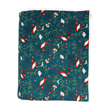 Load image into Gallery viewer, Blanket with foxes, rabbits, and mushrooms on a green background.