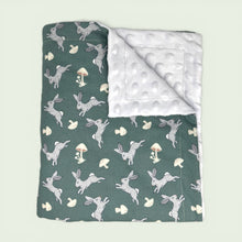 Load image into Gallery viewer, Blanket with rabbit and mushroom pattern on one side and white reverse side.