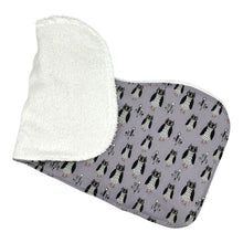 Load image into Gallery viewer, Burpcloth with owl pattern on a light purple background. End turned to show white terrycloth backing.