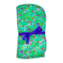 Load image into Gallery viewer, Folded burpcloth with purple, pink and red flowers on a green background.