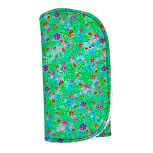Load image into Gallery viewer, Folded burpcloth with purple, pink and red flowers on a green background.