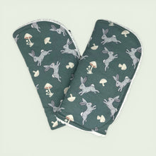 Load image into Gallery viewer, Folded burpcloth set with gray rabbis and mushrooms on a teal background.