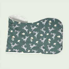 Load image into Gallery viewer, Folded burpcloth set with gray rabbis and mushrooms on a teal background.