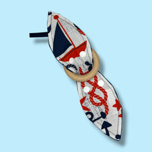Load image into Gallery viewer, Baby teething toy with navy blue and red nautical design and wooden teething ring.