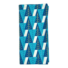 Load image into Gallery viewer, Cotton dinner napkin with contemporary blue and gold winter trees.