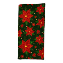Load image into Gallery viewer, A folded cotton napkin with red poinsettias on a green background.