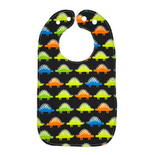 Load image into Gallery viewer, Bib with colorful dinosaur pattern on a black background.