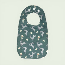 Load image into Gallery viewer, Baby bib with rabbit and mushroom pattern on a teal background.