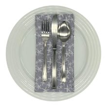 Load image into Gallery viewer, Gray napkin with starfish pattern on a white dinner plate with cutlery.