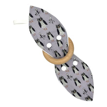 Load image into Gallery viewer, Teething ring with owl pattern on a light purple background.