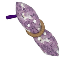 Load image into Gallery viewer, Purple teething ring with unicorn design and wooden ring on a white background