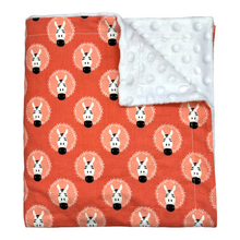 Load image into Gallery viewer, Blanket with fun zebra design on a coral pink background.