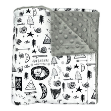 Load image into Gallery viewer, Blanket with fun black & white nature design.