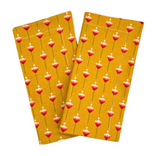 Load image into Gallery viewer, Two mustard yellow napkins with red floral pattern on a white background