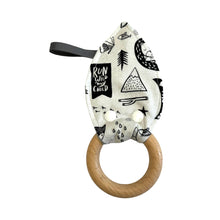 Load image into Gallery viewer, Teething ring with wooden ring and nature patterned fabric.