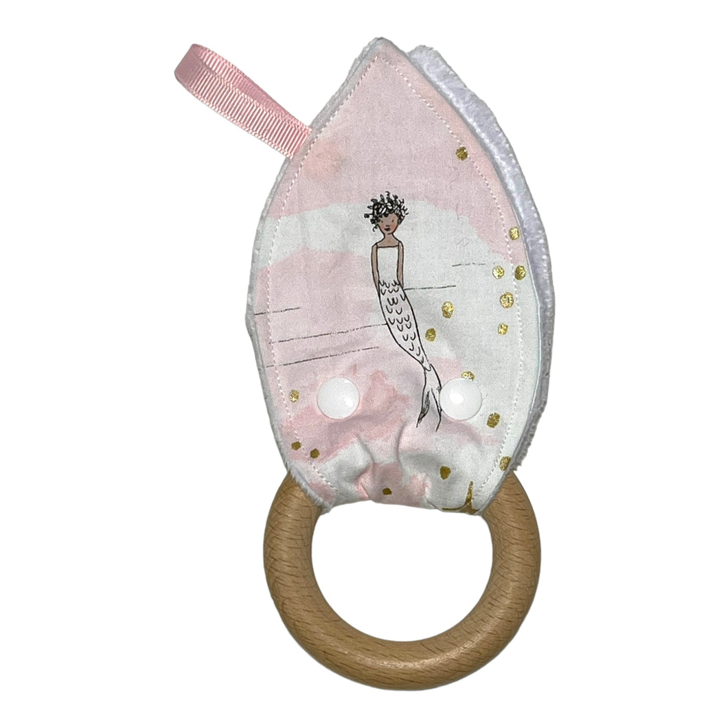 Baby  Crinkle Teether by Mimi's Little Loveys. Whimsical mermaids & narwhals on a light pink background with metallic gold accents.