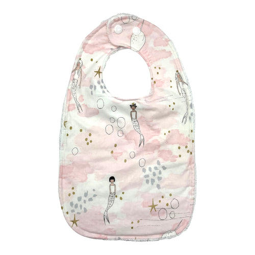 Baby Everyday bib by Mimi's Little Loveys. Whimsical mermaids & narwhals on a light pink background with metallic gold accents.