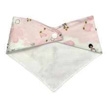 Load image into Gallery viewer, Baby bandana bib by Mimi&#39;s Little Loveys. Whimsical mermaids &amp; narwhals on a light pink background with metallic gold accents. Image shows reverse with single fastening snap and flannel backing.
