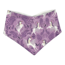 Load image into Gallery viewer, Baby bandana bib by Mimi&#39;s Little Loveys. White unicorns on a purple background. Leaf and flower details.
