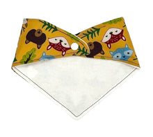 Load image into Gallery viewer, Baby bandana bib by Mimi&#39;s Little Loveys. Fun and vibrant design, featuring group of Maine friends - bear, beaver, deer, fox, raccoon, and skunk - on a mustard yellow background. Backing is soft flannel.
