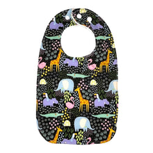 Load image into Gallery viewer, Baby bib Everyday Bib by Mimi&#39;s Little Loveys. Fun and vibrant design, featuring crocodiles, elephants, flamingos, giraffes, hippos, tortoises, plants, and flowers, on a black background. Backing is soft, white, terry cloth.
