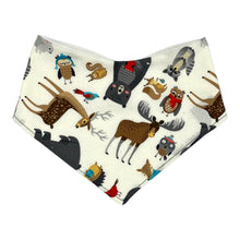 Load image into Gallery viewer, Baby bandana bib by Mimi&#39;s Little Loveys. Front features a collection of Maine critters: bears, cardinals, deer, moose, owls, porcupines, raccoons, squirrels, all on a white background. Backing is soft, white, flannel.
