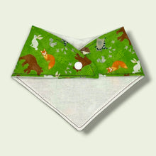 Load image into Gallery viewer, Baby bandana bib, with bears, foxes, hedgehogs, owls, raccoons, squirrels, on a green background.
