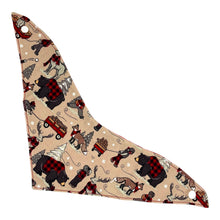 Load image into Gallery viewer, A baby bandana bib with a fabric winter plaid pattern featuring bears, beavers, deer, and foxes in a snowy setting. Bib shown outstretched.
