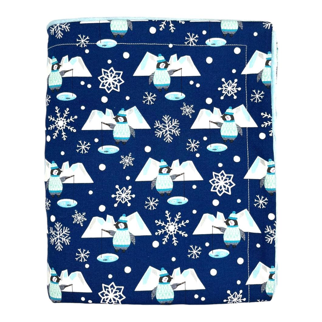 Baby and kids blue blanket with penguins fishing, icebergs, and snowflakes.