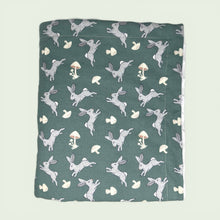 Load image into Gallery viewer, Blanket with rabbit and mushroom pattern on one side and white reverse side.
