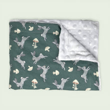 Load image into Gallery viewer, Blanket with rabbit and mushroom pattern on one side and white reverse side.
