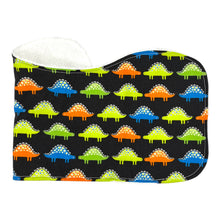 Load image into Gallery viewer, Folded burpcloth with colorful dinosaur pattern on a black background.
