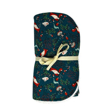 Load image into Gallery viewer, Folded burpcloth with foxes, rabbits, hedgehogs, and mushrooms, on a green background.

