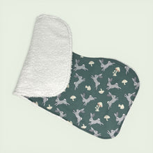 Load image into Gallery viewer, Folded burpcloth set with gray rabbis and mushrooms on a teal background.
