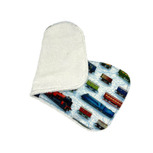 Load image into Gallery viewer, Folded burpcloth with steam trains and rolling stock design.
