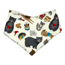 Load image into Gallery viewer, Baby bandana bib by Mimi&#39;s Little Loveys. Front features a collection of Maine critters: bears, cardinals, deer, moose, owls, porcupines, raccoons, squirrels, all on a white background. Backing is soft, white, flannel.
