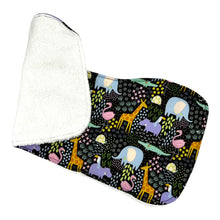 Load image into Gallery viewer, Burpcloth set by Mimi&#39;s Little Loveys. Fun and vibrant design, featuring crocodiles, elephants, flamingos, giraffes, hippos, tortoises, plants, and flowers, on a black background. Backing is soft, white, terry cloth.
