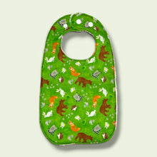 Load image into Gallery viewer, Baby bib, with bears, foxes, hedgehogs, owls, raccoons, squirrels, on a green background.
