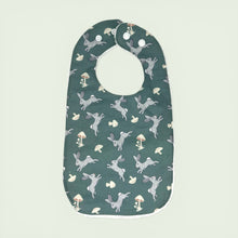 Load image into Gallery viewer, Baby bib with rabbit and mushroom pattern on a teal background.
