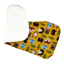 Load image into Gallery viewer, Burpcloth set by Mimi&#39;s Little Loveys. Fun and vibrant design, featuring group of Maine friends - bear, beaver, deer, fox, raccoon, and skunk - on a mustard yellow background. Backing is soft, white, terry cloth.
