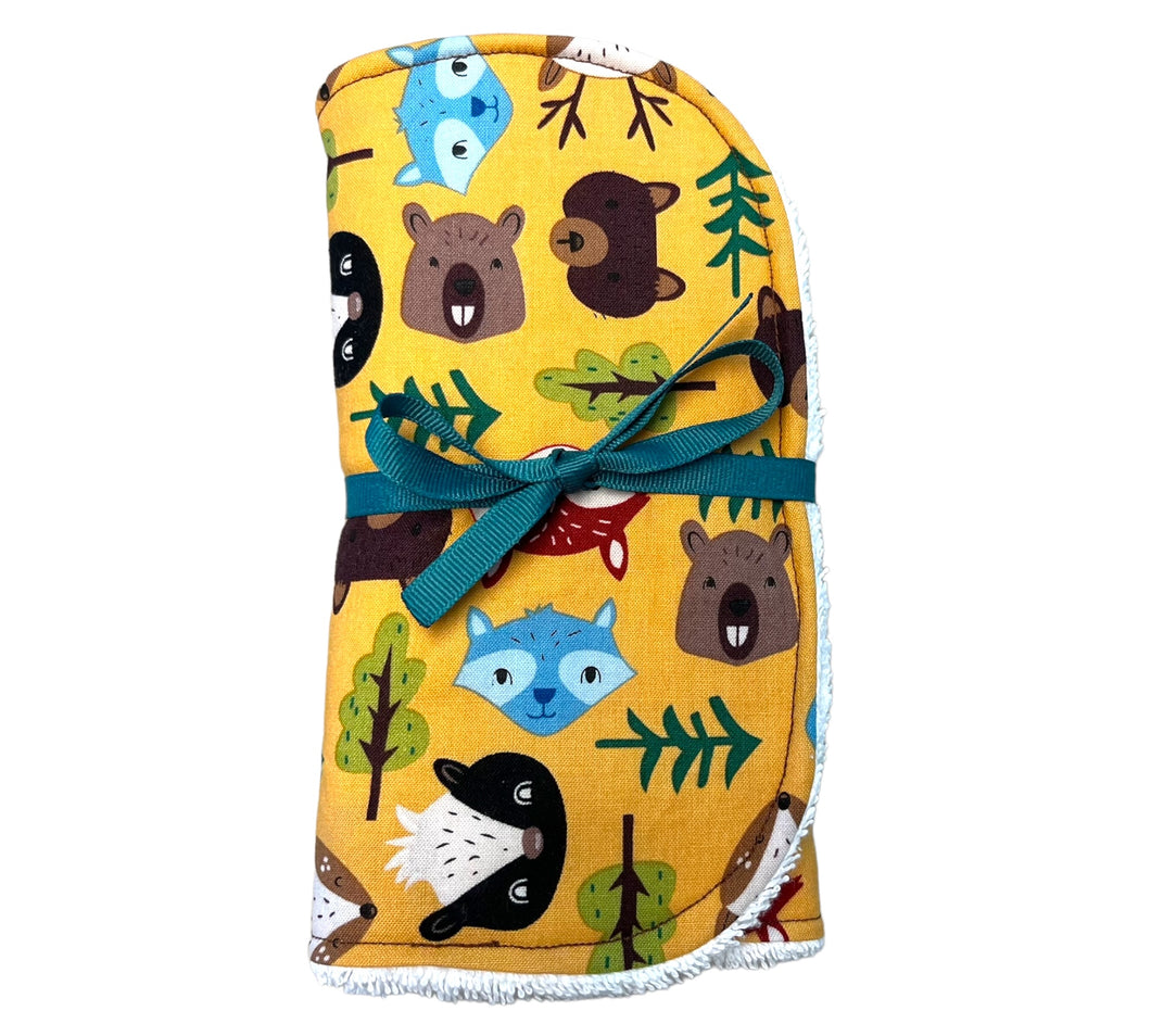 Burpcloth set by Mimi's Little Loveys. Fun and vibrant design, featuring group of Maine friends - bear, beaver, deer, fox, raccoon, and skunk - on a mustard yellow background. Backing is soft, white, terry cloth.