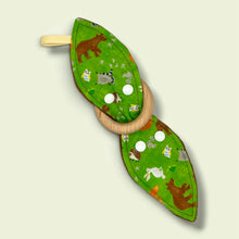 Load image into Gallery viewer, Teething toy with bears, foxes, hedgehogs, owls, raccoons, squirrels, on a green background.
