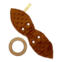 Load image into Gallery viewer, Baby Crinkle Teether by Mimi's Little Loveys. Features cute foxes, raccoons, squirrels in a forest scene. Shades of browns, oranges, grays, and greens, on a yellow background, and a wooden teething ring. Brown dimple minky backing with detached wooden teething ring.
