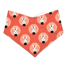 Load image into Gallery viewer, Baby bandana-style bib with zebra pattern on a coral pink background.
