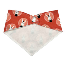 Load image into Gallery viewer, Back of a baby bandana-style bib with zebra pattern on a coral pink background. Shows the flannel backing and snap closure.
