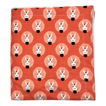 Load image into Gallery viewer, Blanket with fun zebra design on a coral pink background. 
